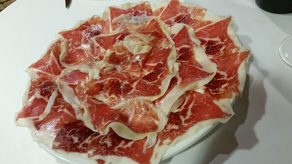 Jamón ibérico, carved thin and served at room temperature.